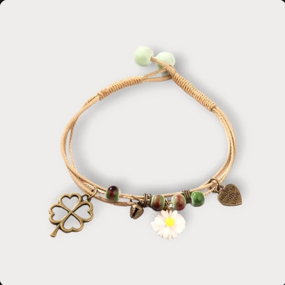 Layered heart and daisy bracelet